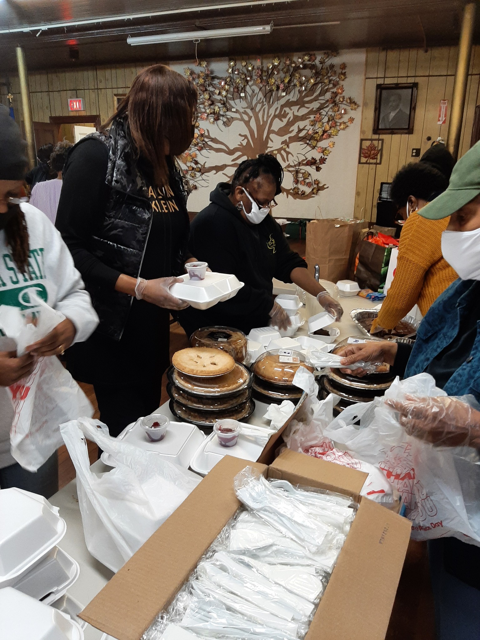 Volunteers packaging meals at the church community dinner